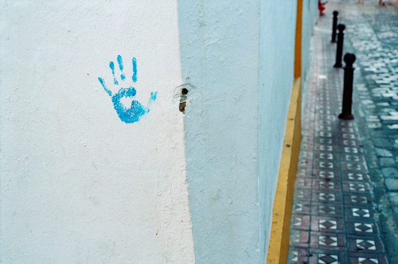 blue hand print on wall, Tarifa, Spain