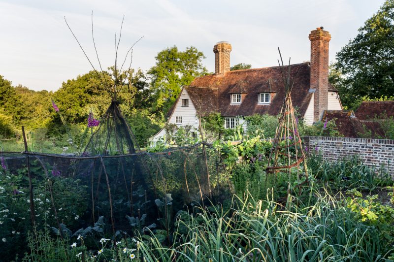 Rolf's Farm - view of house through new vegetable garden designed by the head gardener, Kate Langdon