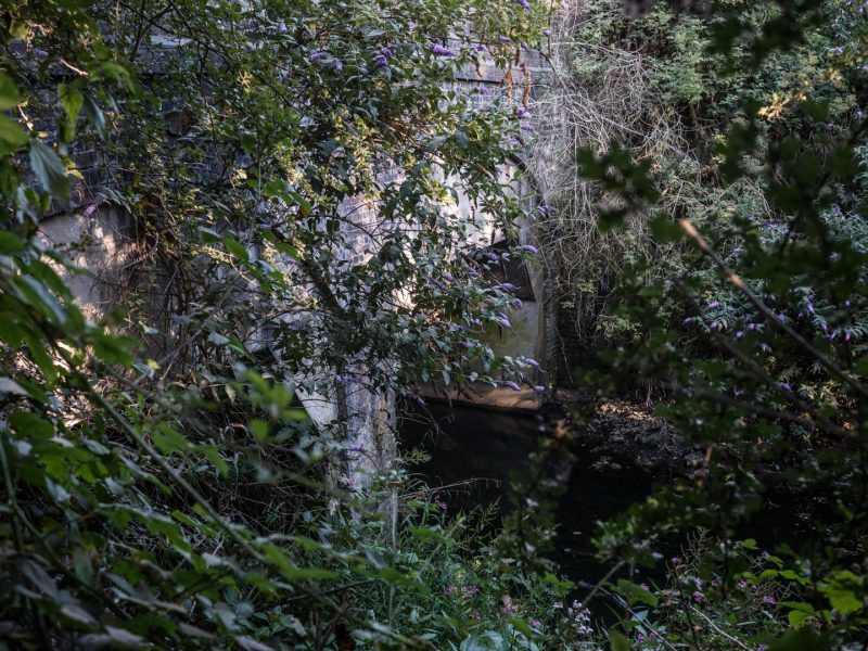 River Brent emerging from tunnel under railway at Wembley
